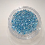 Стеклянный бисер 25г (крупный) прозрачный с цветным стержнем (голубой) (Б041)